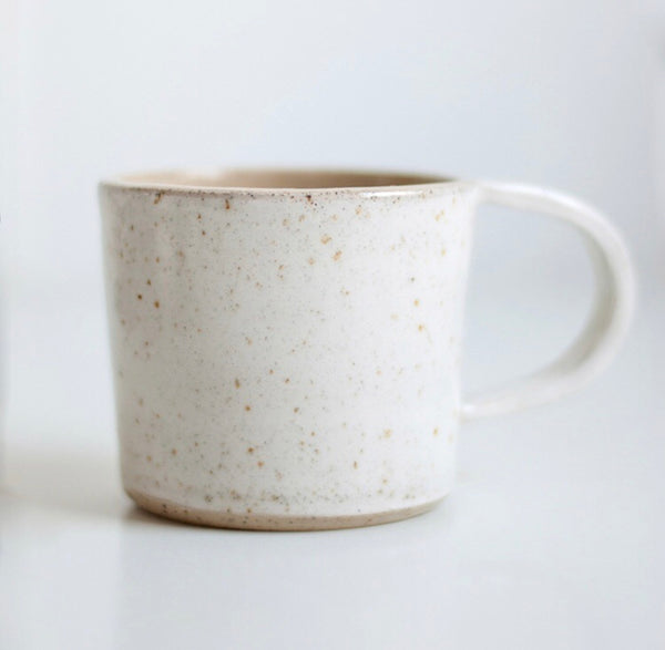 The handmade cups are made of speckled stoneware with a white layer on the outside. The cup is then finished with a glossy or matt glaze.  Dimensions cup: Height about 7.5 cm 8.5 cm in diameter  Preferably wash by hand, dishwasher is not recommended