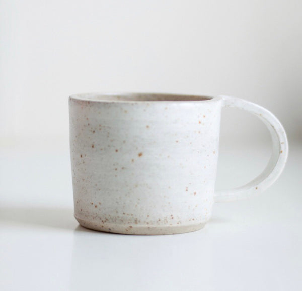The handmade cups are made of speckled stoneware with a white layer on the outside. The cup is then finished with a glossy or matt glaze.  Dimensions cup: Height about 7.5 cm 8.5 cm in diameter  Preferably wash by hand, dishwasher is not recommended